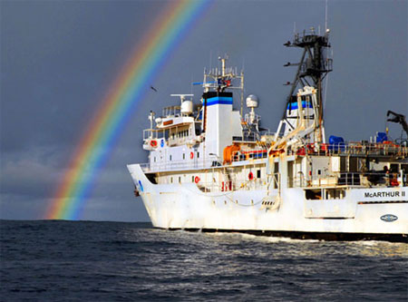 The NOAA Ship McArthur II watches the remnants of Hurricane Henrietta fade into the distance