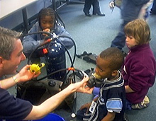 Kids learn about the equipment that allows SCUBA divers to breathe underwater.