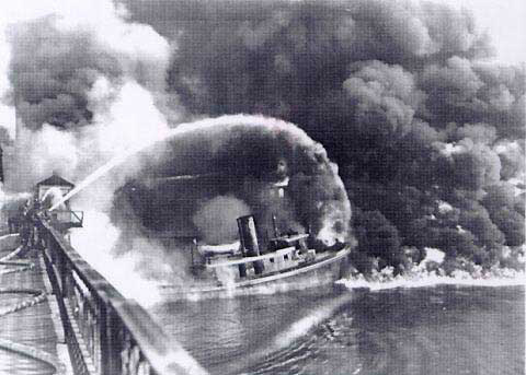 Firefighters battle the 1969 Cuyahoga River fire.