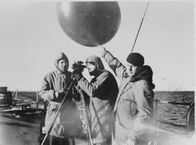 A pilot balloon is launched from a U.S. Coast Guard vessel