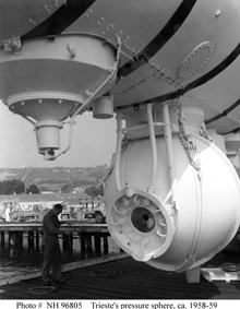 Close up view of the front of Trieste's pressure sphere, showing plexiglass window and instrument leads.
