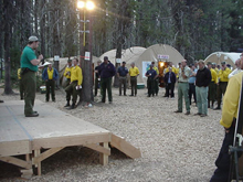 A weather briefing at fire camp. A weather briefing at fire camp.