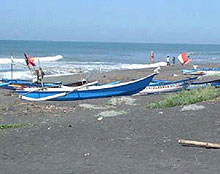 Boats on a beach in Indonesia Boats on a beach in Indonesia