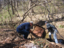 NOAA National Ocean Service Assistant Administrator, Jack Dunnigan, helps Jim Connelly, Anacostia Watershed Society Executive Director, remove a refrigerator from the Watts Brach tributary, February 2006. NOAA National Ocean Service Assistant Administrator, Jack Dunnigan, helps Jim Connelly, Anacostia Watershed Society Executive Director, remove a refrigerator from the Watts Brach tributary, February 2006.