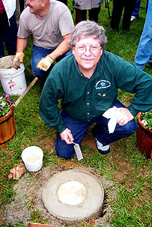 NOAA geodesist Dave Doyle sets the commemorative mark NOAA geodesist Dave Doyle sets the commemorative mark