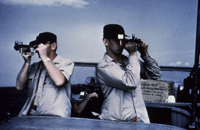 Two hydrographers shoot a sextant fix for hydrographic surveying. Two hydrographers shoot a sextant fix for hydrographic surveying.