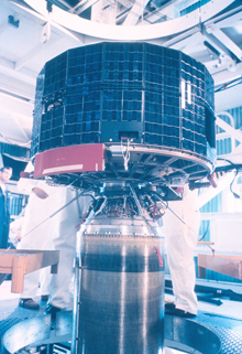 The TIROS 1 satellite mated to a rocket for launching. The TIROS 1 satellite mated to a rocket for launching.