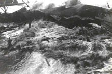 Image shows the 1946 tsunami inundating Hilo, Hawaii. Image shows the 1946 tsunami inundating Hilo, Hawaii.