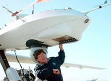 A NOAA researcher conducts preflight tests before flying the Altair unmanned aircraft system. A NOAA researcher conducts preflight tests before flying the Altair unmanned aircraft system.